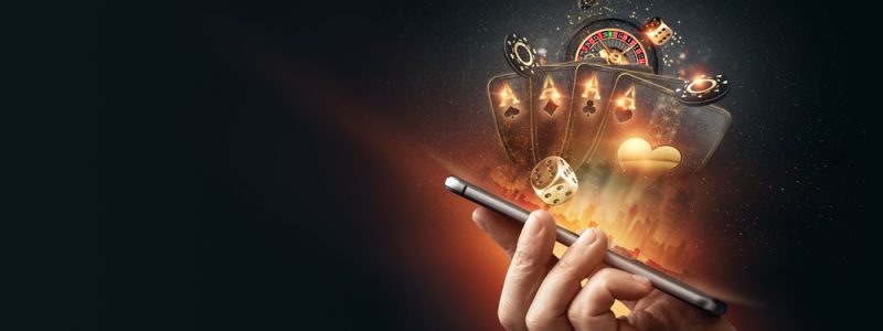 Creative,Background,,Online,Casino,,In,A,Man's,Hand,A,Smartphone